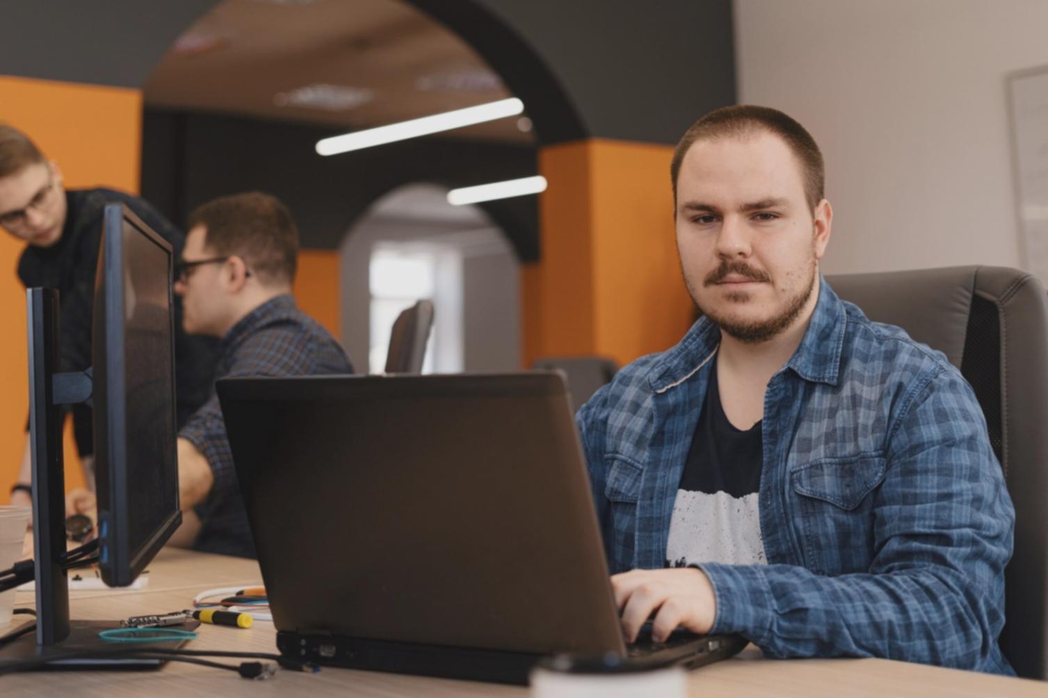 Team collaboration session analyzing blockchain network data and transaction patterns